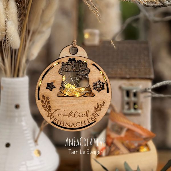 Weihnachtskugel aus Holz mit LED – Geschenkesack
